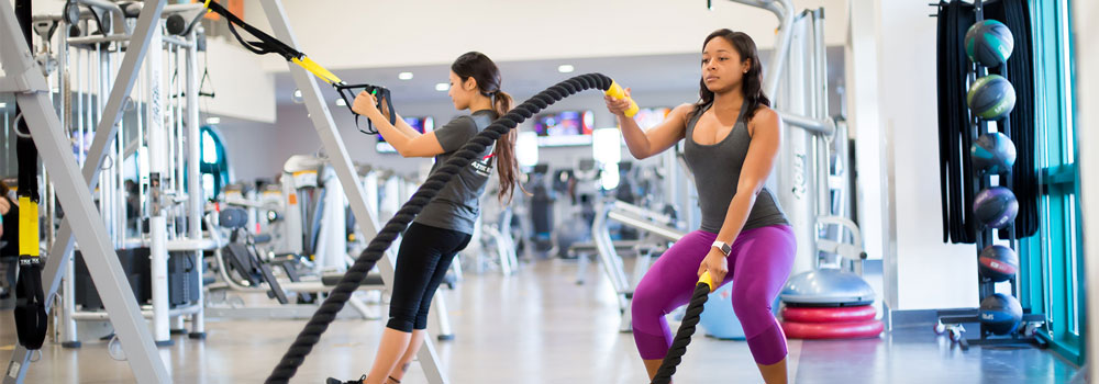 ARX Express - Student doing battle ropes to work out