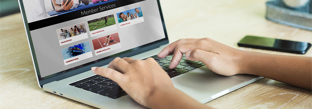 Visiting Aztec Recreation website on a laptop