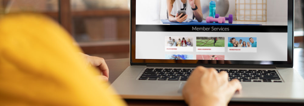 Browsing Aztec Rec website on laptop